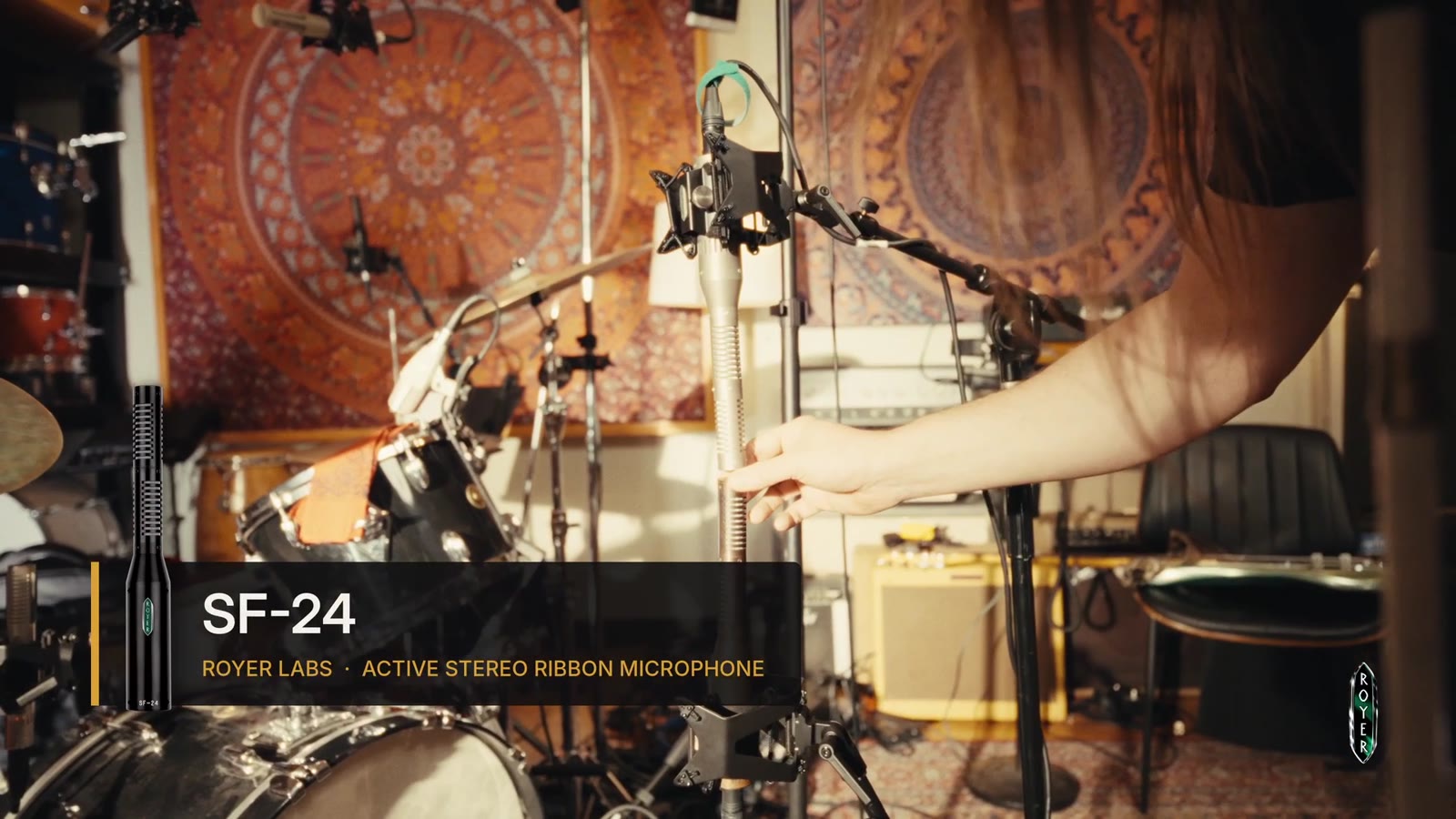 Royer SF-24 active stereo ribbon microphone on a tall stand as a room mic in front of the drum kit