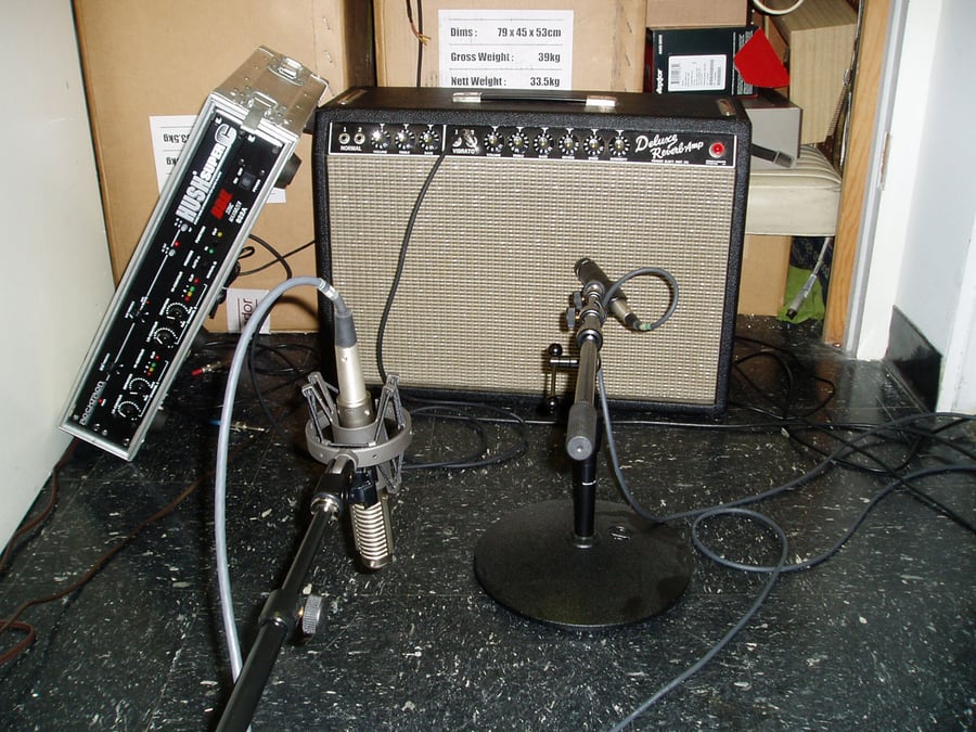 R-121 at a distance from a guitar amp at a Ray Charles and Norah Jones session