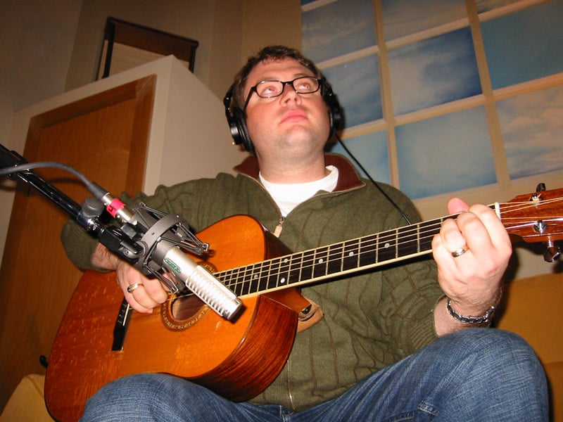 Steve Page of Barenaked Ladies tracking acoustic guitar with a backward R-121, second view