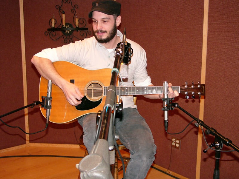 A pair of R-122s spaced wide apart on an acoustic guitar with a large diaphragm condenser between them